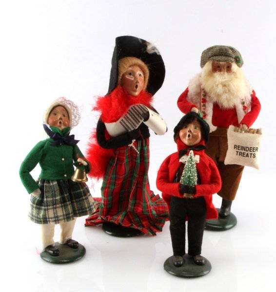 LOT OF FOUR BYERS CHOICE THE CAROLERS DOLLS: One 1996 Byers Choice The Carolers Boy with Christmas Tree, good condition with no scratches, chips, or cracks. One 1996 Byers Choice The Carolers Woman with music sheet, good condition with no scratc