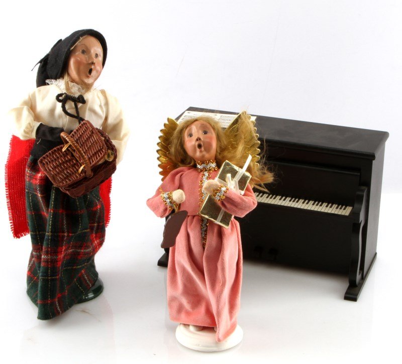 TWO BYERS CHOICE CAROLER DOLLS AND PIANO: One Byers Choice Angel doll, good condition with no scratches, chips, or cracks. One Caroler Woman with picnic basket, good condition with no scratches, chips, or cracks. One Byers Choice 1995 Louise 