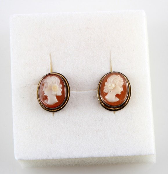 VINTAGE SILVER CAMEO EARRINGS WITH SCREW BACKS: Vintage 800 silver cameo earrings with screw backs. White shell with coral background. The cameo measures .5 inches tall. The cameos appear to have been carved by two different people, but are still m