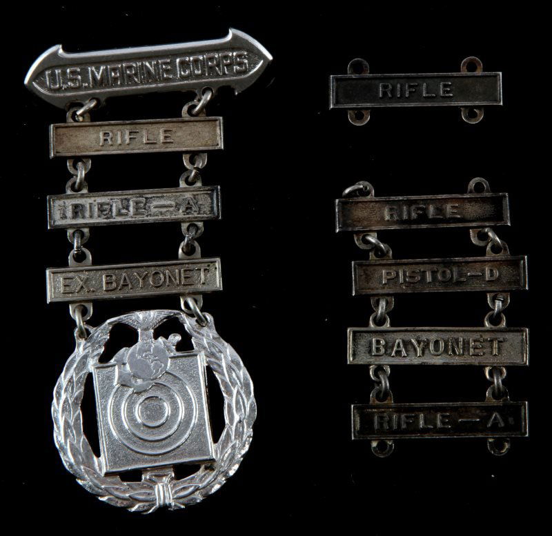 USMC MARKSMAN BADGE 3 QUALIFICATION BARS & EXTRAS: Badge with three bars and five extra duplicates, one being sterling. No maker marks.