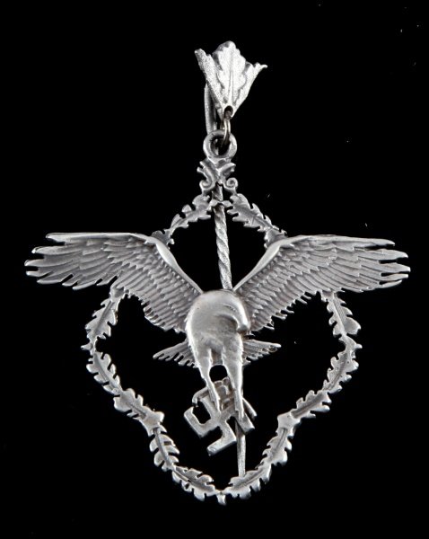GERMAN WWII LUFTWAFFE BROOCH OF A FEMALE PILOT: German WWII Luftwaffe brooch of a female pilot. Item bears maker's silver markings. Unauthenticated, sold as is.This lot has a reserve.