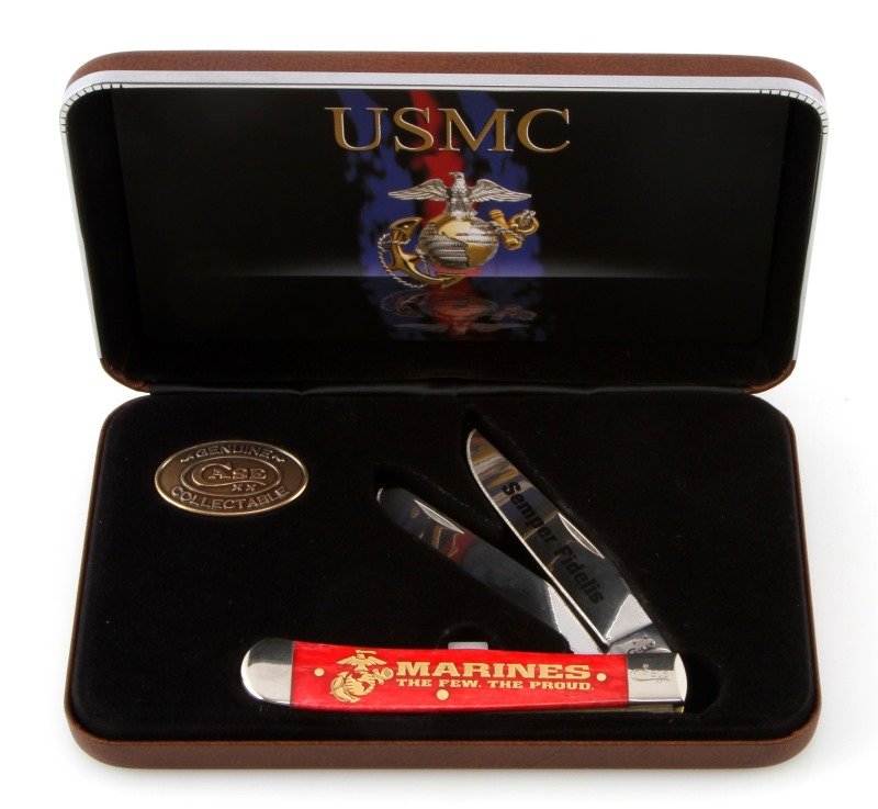 CASE XX RED TRAPPER USMC COMMEMORATIVE KNIFE: One Case XX Trapper red US Marine Core Commemorative knife. Item comes in a leather display box. Knife features two stainless steel blades,and a red bone handle. Knife measures approximately 4-1/4" cl