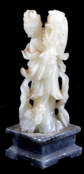 CHINESE SOAPSTONE CARVING OF WOMAN 4 INCHES TALL: Chinese soapstone carving of a woman carrying basket, measures 4 inches tall with base. Item is in very good condition with no visible signs of damage.