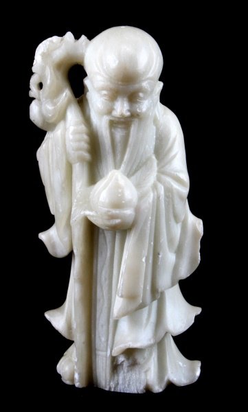 CHINESE SOAPSTONE CARVING OF WISE OLD MAN SAU: A Chinese soapstone carving of the god of longevity, Sau. Stands 6.25 inches tall. In very good condition with some surface wear as photographed.