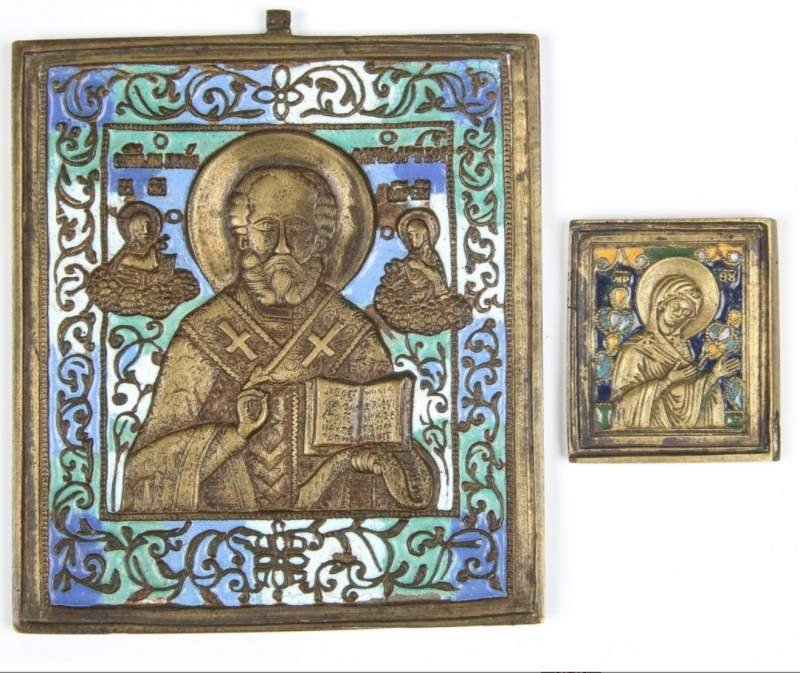A PAIR OF ENAMELED BRONZE 19TH C. RUSSIAN ICONS: This lot includes two 19th century Russian enameled bronze icons. The larger one is of St. Nicholas; it measures 4.5 by 4 inches. The snaller one shows the Mother of God and is double sided; it measur
