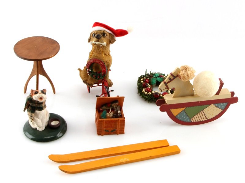 LOT OF BYERS CHOICE CAROLERS ACCESSORIES: Lot of Byers Choice Accessories. Included is a 1997 cat, a Styrofoam ball, one wood box with presents, one dog with merry Christmas sign, one rocking horse, one wreath, one set of skis, one red bicycl