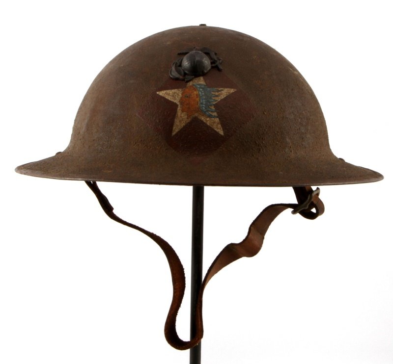 USMC WWI 6TH REGIMENT MACHINE GUN BATTALION HELMET: USMC World War I 6th Marine Corps Regiment Machine Gun Battalion Combat Helmet. The front has a hand painted Indian Chief’s head in the center of a white star with a purple diamond back ground. Ther