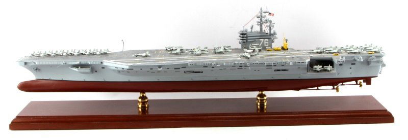USS RONALD REAGAN CVN-76 MAHOGANY SHIP MODEL 1/350: One USS Ronald Reagan CVN-76 Mahogany Ship model. Item measures 31" long, 9" tall, and about 6" wide. Item is in very good condition except for one part of the edge of the top deck which is slightly d