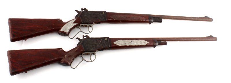 PAIR OF 1960S LEVER ACTION TOY RIFLES: A pair of unmarked 1960s toy rifles Each measures 34 inches long. Metal barrel and firing mechanism with plastic stocks. Stocks show some splitting and metal shows patina.