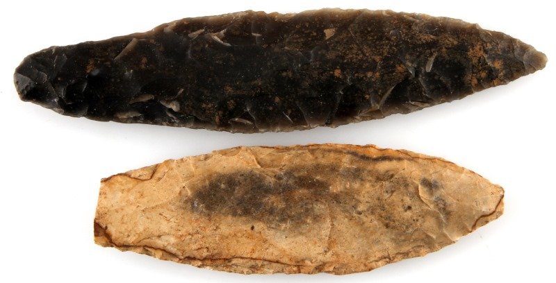 PRE COLUMBIAN MAYAN LITHIC ARROWHEAD BLADE LOT: Two Bifacial blades submerged finds from Belize , New River region, measuring 4 and 5 inches and the lighter one has an old but since water worn area of damage. From a deceased Louisiana Merchant Mari