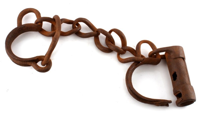 HAND FORGED 19TH CENT. SLAVE PRISONER LEG SHACKLES: Prisoner or slave fetters or leg irons, the locking receiving end is rusted, measures 25 inches end to end, without key.