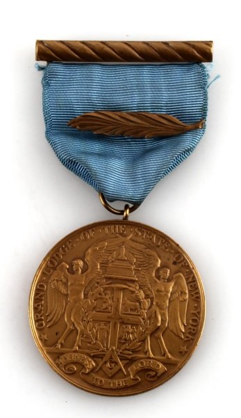 GRAND LODGE OF NEW YORK CUSTOM FREEMASON MEDAL: On the front is the Ney York Lodge logo. The back says "for a half century devotion to the craft" around the outer edge. The inside says "awarded to brother John M. Kimble raised Mar. 16 1896 ANNO LUC