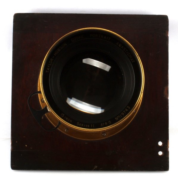 LARGE FORMAT TAYLOR-HOBSON COOKE PORTRAIT LENS: A 1920s Taylor Hobson Cooke antistigmat 15-inch series lens with knuckler ring. Has sharp and soft focus options, f/4.5 aperture. Mounted on a front standard with leaf shutter. Elements appear to be i