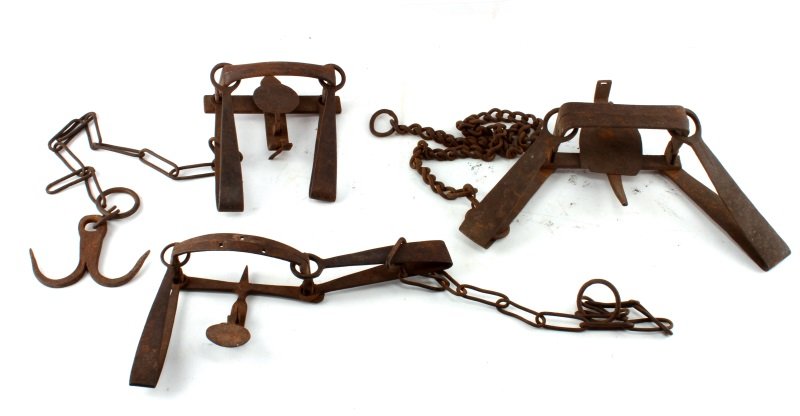 LOT OF 3 VINTAGE CAST IRON SMALL GAME ANIMAL TRAPS: This lot contains 3 antique double spring small-game animal traps, most likely used for rabbit, squirrels, badgers etc. All three traps appear to be in good working condition, with wear & tear typical