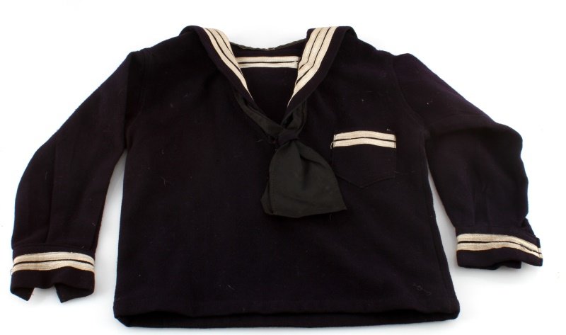WWII CHILDS U.S. NAVY CRACKER JACK JUMPER: Toddler jumper with second class petty officer chevrons, about for a three year old.