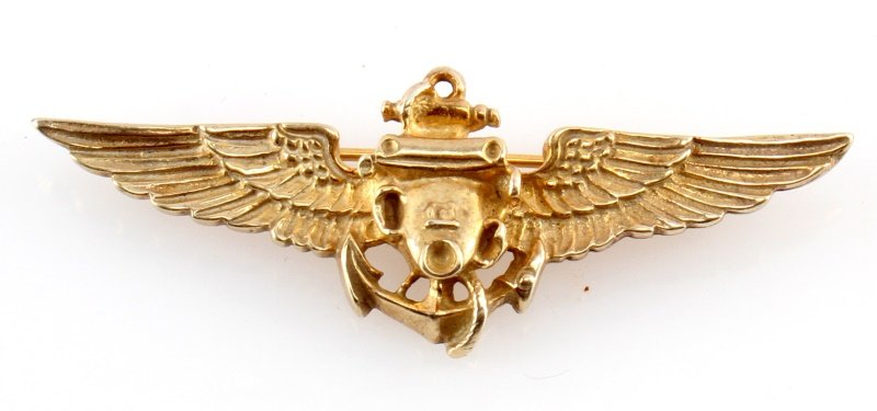 WWII US NAVY RECON PHOTOGRAPHER WINGS STERLING: A pair of sterling silver Navy photographer wings. Have Fischer maker's mark on rear. These wings were only issued for a short time in early World War II. In near excellent condition with some light p