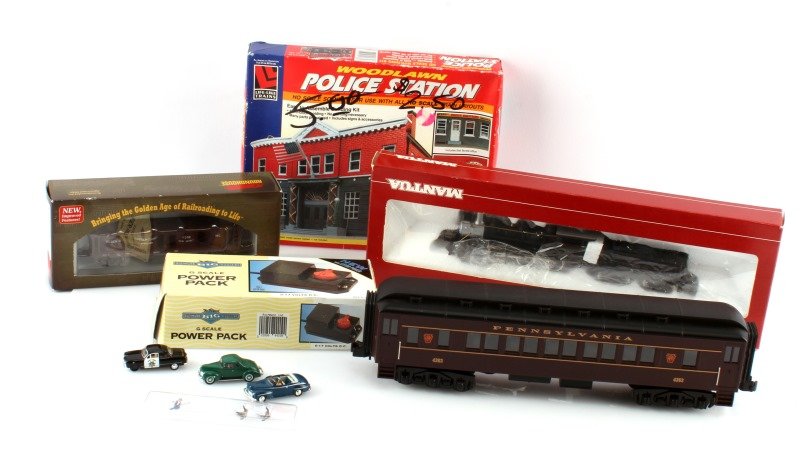 MIXED MODEL TRAIN LOT WITH POWER PACK POLICE MODEL: Mixed model train lot to include: Pennsylvania MTH electric O scale train, Roundhouse HO scale pickle car, Mantua 313-20 Mogul, Bachmann G scale power pack, 3 mini model cars, and Woodlawn Police stat