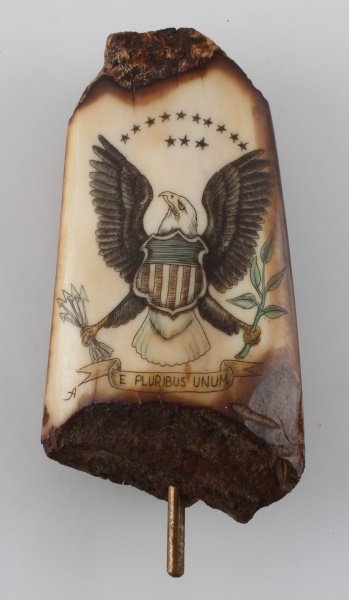 19TH CENTURY FOSSIL IVORY SCRIMSHAW FEDERAL EAGLE: Superb example, fossilized mammoth ivory scrimshaw. Measures 90 mm, free of damage and repairs.