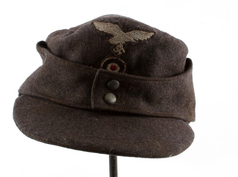 WWII THIRD REICH LUFTWAFFE M43 CAP W/ CLOTH EAGLE: A grey wool Luftwaffe cap with embroidered eagle. About size 57. Some wear to liner as photographed. amrked on liner.