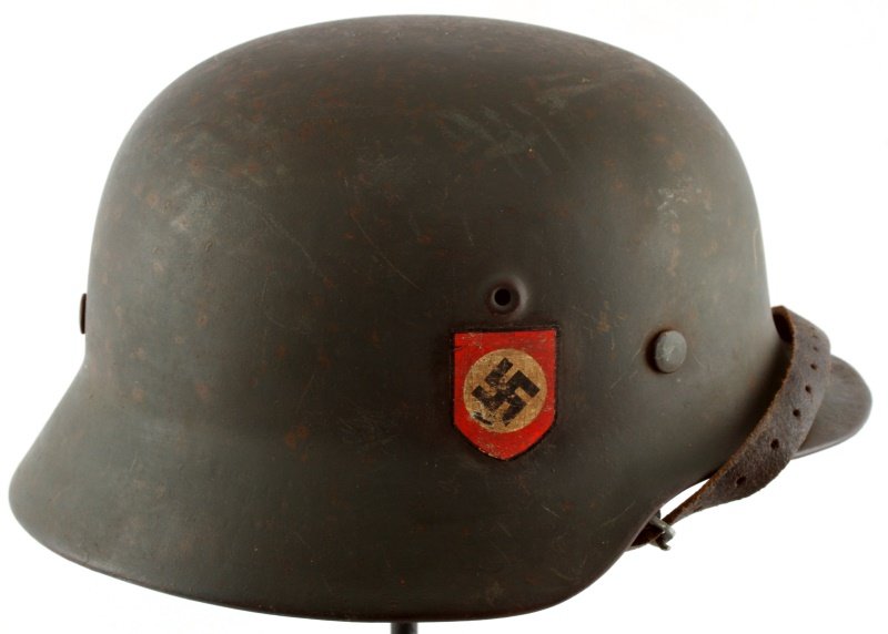 GERMAN WWII M40 POLICE HELMET DOUBLE DECAL: German WWII M40 Police helmet with double decals, has the Swastika decal on one side and police insignia on the other. Eight finger leather liner with 5 holes in each finger. Marked 23 on the back ski