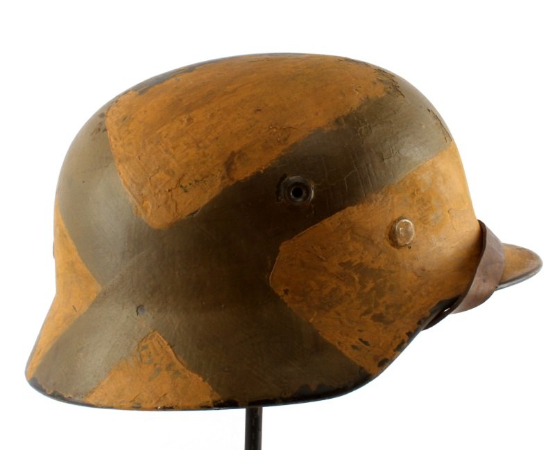 WWII GERMAN THIRD REICH GERMAN M-40 PAINTED HELMET: The paint on this helmet is believed post war but the helmet is good, DN353 stamped at back, steel liner with a repaired finger in the liner, Black chin strap.