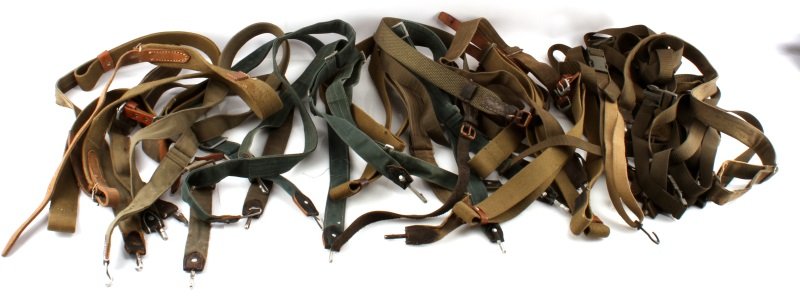 DEALERS LOT RIFLE SLING BIG VARIETY WWII TO MODERN: includes 19 vintage or WWII slings, and 9 ITS Nexus duty straps and buckles, slings include at least 4 British dated and broad arrow marked Sten gun slings, balance are WWII and post war various sling