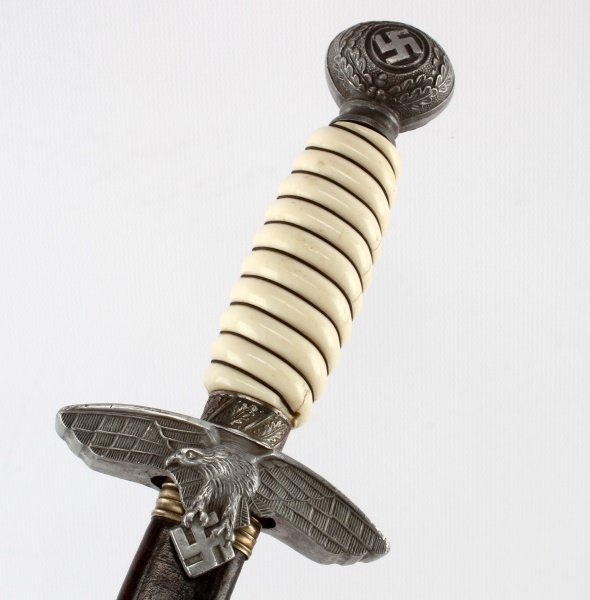 WWII THIRD REICH GERMAN LUFTWAFFE MODEL 2 DAGGER: Second model Luftwaffe dagger, post war production. "GERMANY" on blade. Includes a leather sheath. In very good condition.