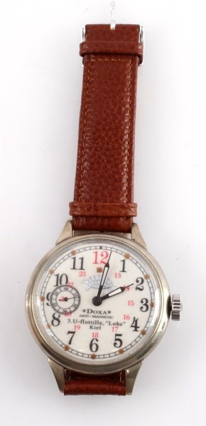 WWII THIRD REICH KRIEGSMARINE U-BOAT WATCH: A pocket watch converted to a wristwatch with U-boat flotilla "Lohs" insignia on dial. The watch is made by Doxa and it has a seconds sub dial by 9 o'clock position. In very good condition and running
