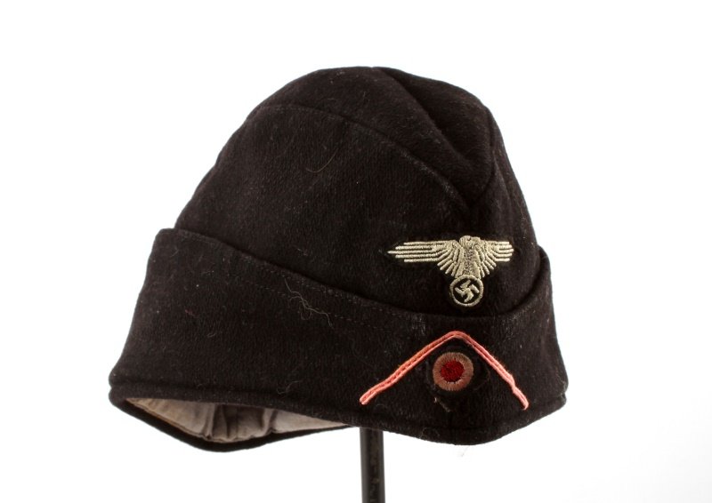 WWII THIRD REICH SS PANZER GARRISON CAP BLACK: A black panzer garrison cap with embroidered eagle, cockade and pink panzer chevron. In very good condition. Medium size. Unauthenticated, sold as is.