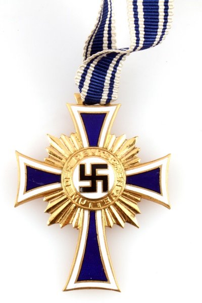 WWII GERMAN GOLD MOTHERS CROSS WITH COFFIN CASE: One German WWII Mothers Cross with coffin case. Item has ribbon, and coffin case, and both pass the black light test. Medal itself is in good condition with no chips or cracks, and only one light scra