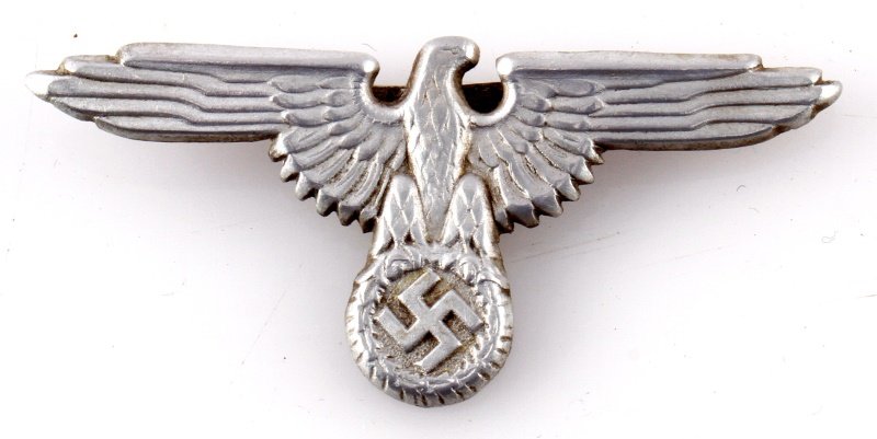 GERMAN WWII THIRD REICH SS HAT BADGE: German WWII SS eagle visor badge. The reverse is marked Ges Gesch. Measures 2.75 inches wide. Unauthenticated, sold as is.