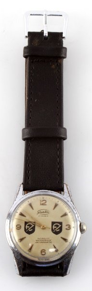 WWII THIRD REICH 20TH ESTONIAN DIVISION WATCH: Waffen SS 20th Estonian division watch. Made by Grandia. 17 jewel incabloc, waterproof and antimagnetic Swiss-made movement. In very good condition with some wear to case. Runs well.