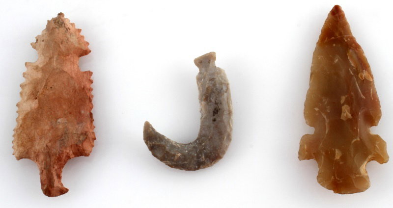 LOT OF 3 EXOTIC ECCENTRIC ARROWHEAD POINTS: Group of Exotic Eccentric points. Includes: a grey chert hook point "J" shaped, 2 inches, a double notched Chalcedony point, worn to touch, and broad flaking, and a sharp serrated pink chert point wit