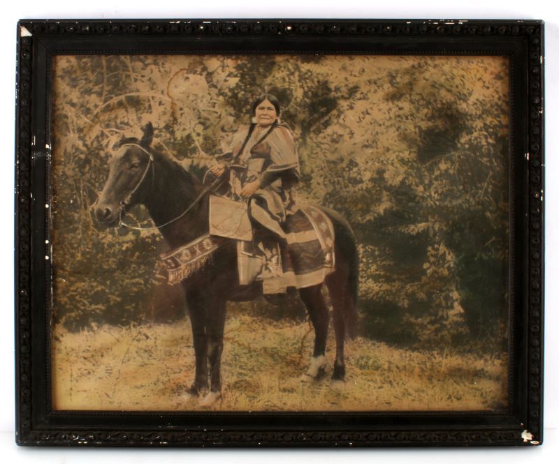 ANTIQUE COLORED ALBUMEN OF INDIAN WOMAN: Late 19th or early 20th century, possible Crow Woman, very good photo measures 17 by 14, with frame 20 by 16, frame has some gesso loss.