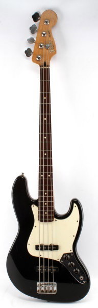 FENDER JAZZ BASS ELECTRIC GUITAR BLACK W/ ROSEWOOD: A Fender Jazz Bass in black with rosewood fret board. Made in Mexico in 1992. Shows signs of wear in the form of scuffs, patination and dings throughout but plays well. Light weight and well balanced 