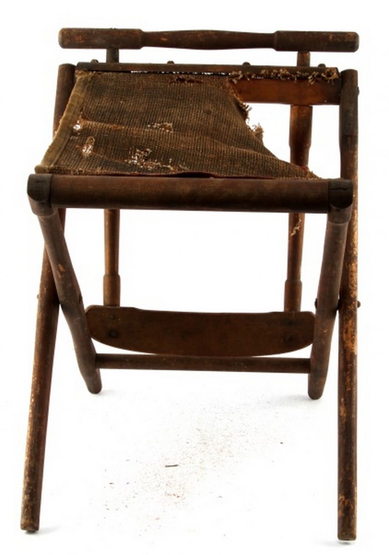 CIVIL WAR ERA FOLDING FIELD CHAIR: Condition commensurate with date. Some holes to the canvas part of the chair. Marked" BJ Harrison Arkvili"