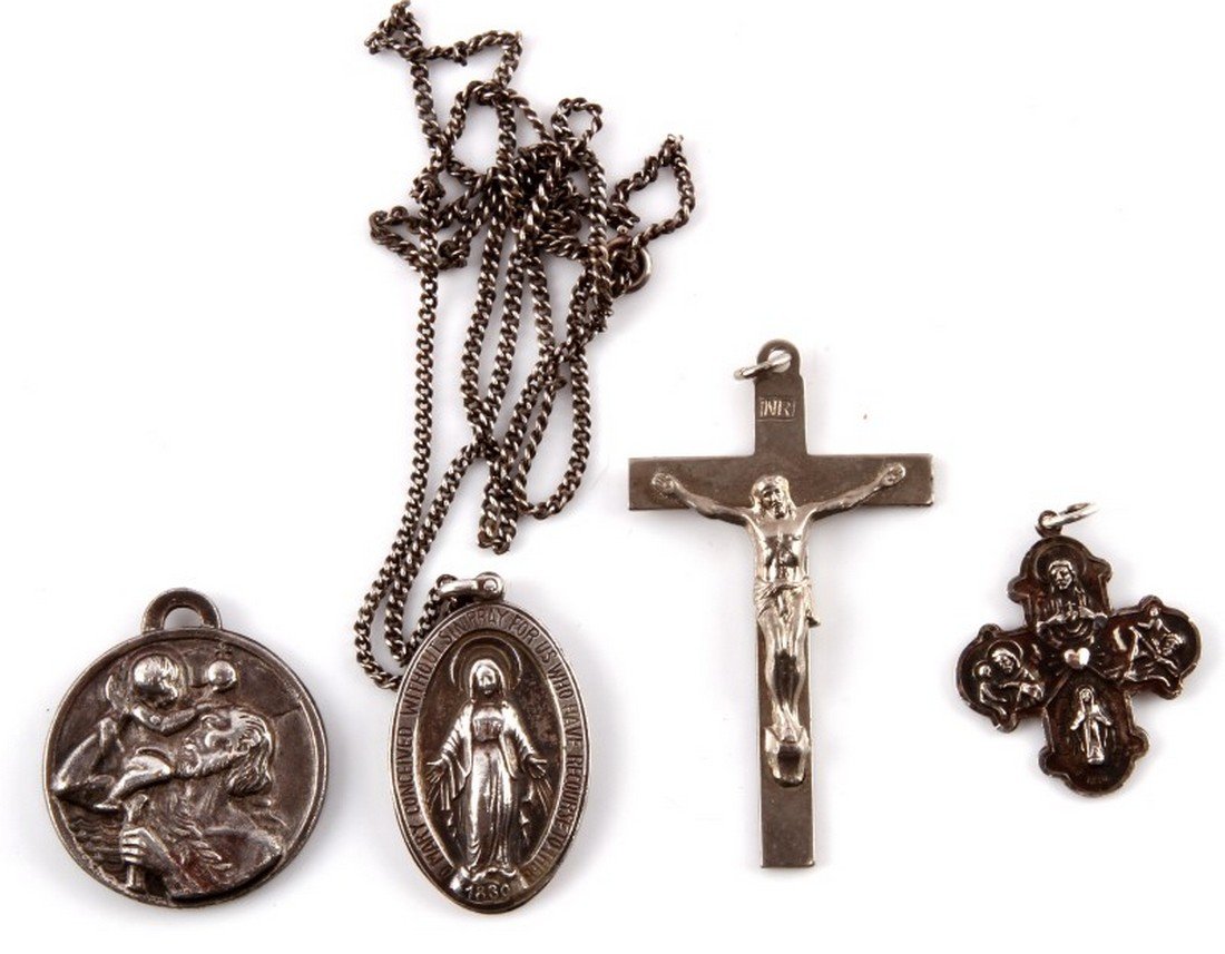 MIXED LOT FOUR OF CATHOLIC RELIGIOUS PENDANTS: Lot of four Catholic pedants including two sterling silver pendants. Includes a crucifix which reads "I am a Catholic in case of accident notify a priest", a medal which reads "Our Lady of the Highway