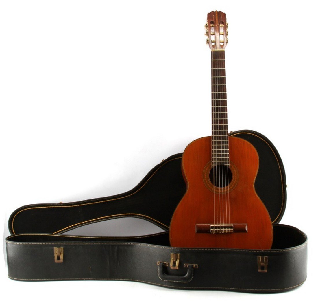 VINTAGE ACOUSTIC CLASSICAL GUITAR SADAO SANO JAPAN: Vintage acoustic guitar, made in Japan. Number 15 by Sadao Sano, master guitar maker. Spruce and mahogany nylon 6 string, scale length 25.75 inches, in good shape with minor wear and dings from use. C