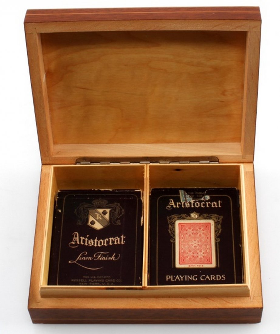 VINTAGE ITALIAN MADE WOODEN CARD BOX W CARDS: Vintage playing card box with two decks of Aristocrat decks. From an inlaid wood factory in Italy. The box measures 6.5 by 5 by 1.75 inches. There are minor chips on the bose of the box, but overall g