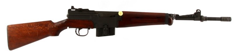 FRENCH MAS MLE 1949-56 SEMI AUTOMATIC RIFLE IN 7.5: French MAS MLE 1949-56 semi automatic rifle in 7.5 mm. Black matte finish, markings to left side frame, fine wood stocks, 20 inch barrel, grenade launcher, and muzzle brake. Bore is dark with some pit
