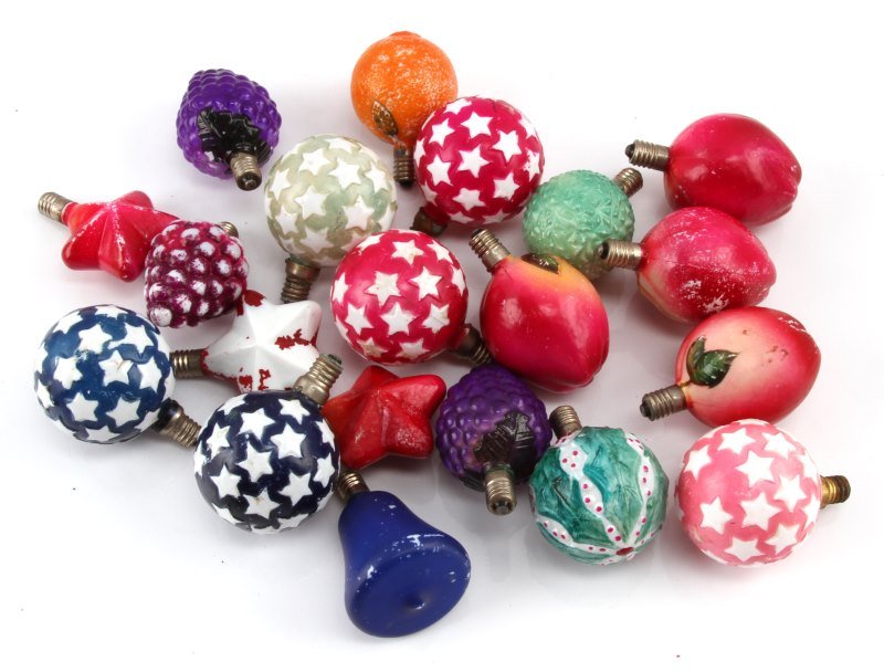 ANTIQUE PAINTED MILK GLASS GLOBE CHRISTMAS LIGHTS: A collection of 20 early-20th century, WWII period, hand painted milk glass Christmas lights. Six star globes (blue, green, pink, red); one holly leaf globe, one green pinecone globe; three grape clus