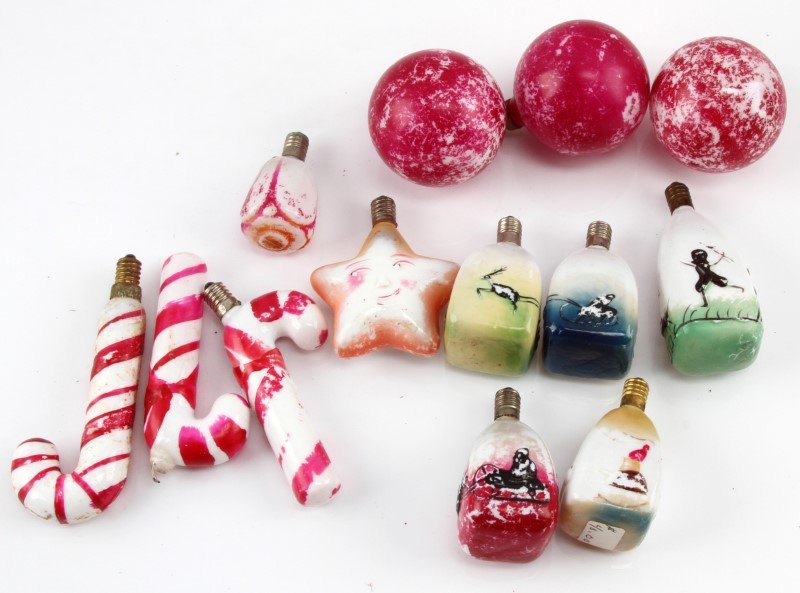 PRE WWII HAND PAINTED MILK GLASS CHRISTMAS LIGHTS: A collection of 13 early 20th century, hand-painted, milk glass, Christmas lights made in Japan prior to WWII (pre-1946). The lights include 3 red globes, 3 candy canes, 1 rose bud, 1 star with a smil