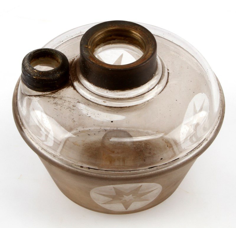 VINTAGE ANTIQUE GLASS OIL LAMP WITH BRASS FITTINGS: One glass oil lamp. Item has a white glaze on bottom portion, but is completely transparent on top portion. Item has brass caps. Item has no cracks, chips, or holes.