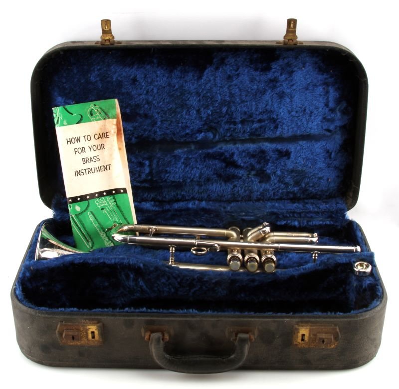 1952 CONN 22B TRUMPET SILVER W BOOK & CASE: Serial Number 409197. Well cared for. Everything appears to be working smoothly. Includes original C.G. Conn Case with medallion, mouthpiece, original 1950s care book, and sheet music clip. Very good 