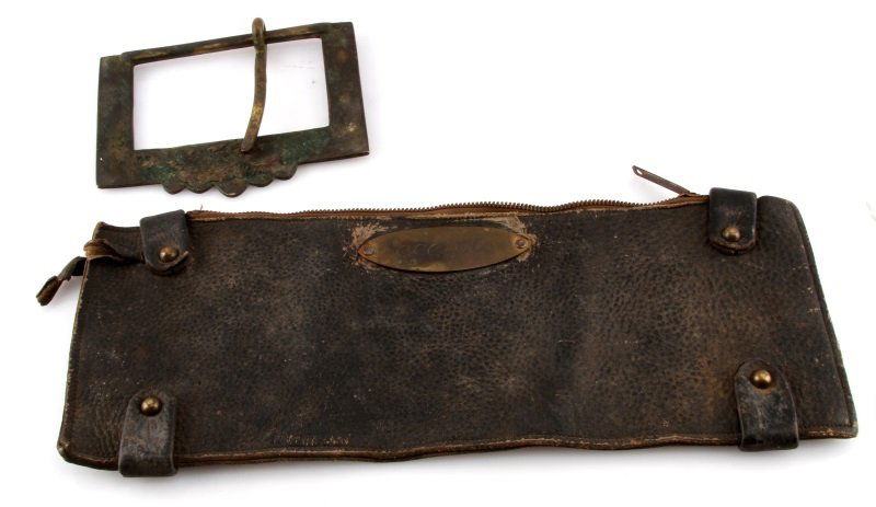 BUFFALO BILL CODY BELT BUCKLE & WILD WEST SHOW BAG: Large belt buckle belonging to the great Western showman William Frederick "Buffalo Bill" Cody (American, 1846-1917). The buckle is monogrammed "W.F.G. on a scalloped edge. The buckle is handmade meta