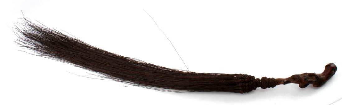 ANTIQUE AFRICAN FLY WHISK WOOD HANDLE: Antique African fly whisk with wooden handle with coarse black hair for the swatter. Measures 34 inches long including the Hair. Overall very good condition.