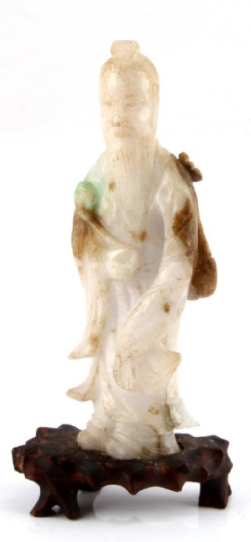 CHINESE JADE FIGURINE W BASE LYNDHURST PLANTATION: The figurine depicts a standing Chinese man in robes with long beard , right hand to abdomen holding a pipe which lays along the right forearm and extends to near the shoulder. The figure stands on a 