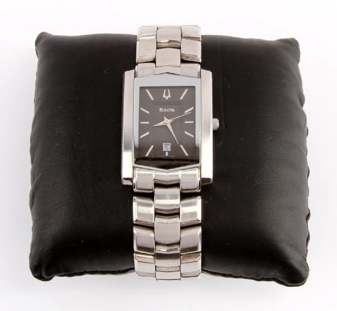 MENS STEEL BULOVA 96G10 QUARTZ WATCH WITH DATE: Model 96G10, stainless steel case, quartz movement, made by Bulova, rectangular case, black dial with date feature. integral bracelet with hidden clasp. In very good running condition.