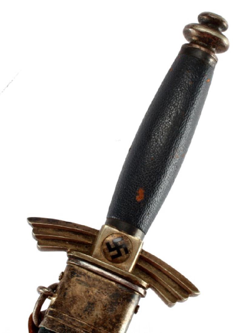 GERMAN WWII 3RD REICH DLV FLYERS DAGGER: Dagger measures 12" long from pommel to point the blade is 7"long and weighs 9.5 Oz. Complete with original single strap leather hanger. Maker is the Gebr. (Brothers) Heller, Marienthal (Balloon Man) 