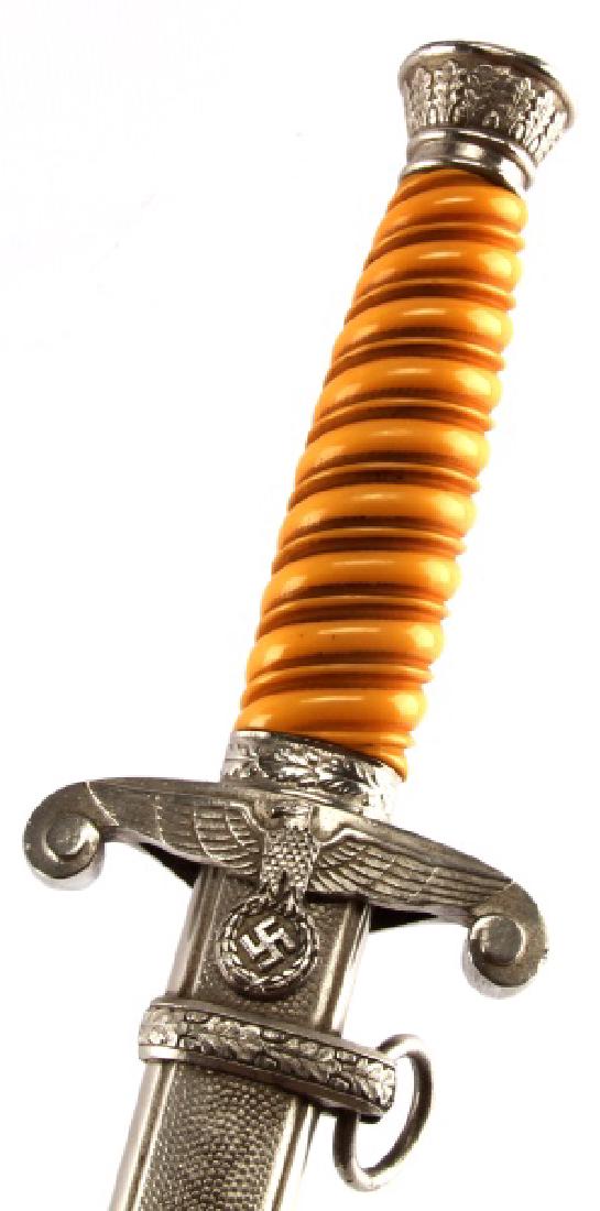WWII THIRD REICH GERMAN HEER ARMY DAGGER: A Heer dagger made by Anton Wingen Jr.. The hilt is in very good condition; its nickel pommel and crossguard show only surface wear and its bakelite grip is free of any detractions. The blade shows or
